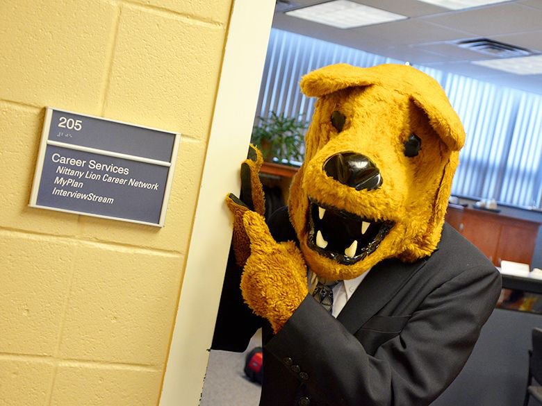 Nittany Lion pointing at the Career Services office sign