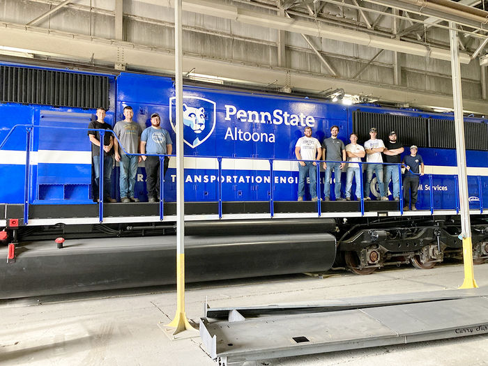 Penn State Altoona RTE students pose with the PSU 2020 locomotive