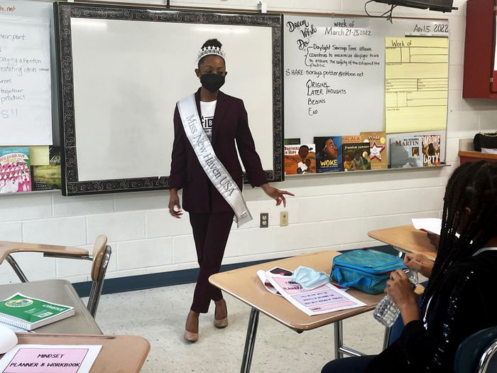 Walker presents her #ImaGirlBoss workshop to young ladies at a Connecticut middle school.