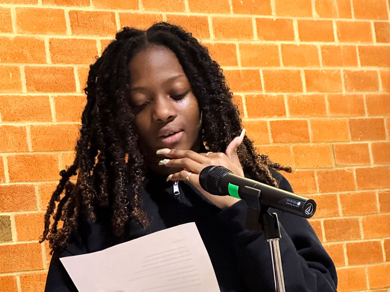 Student Hannah Gabrielle reads a poem