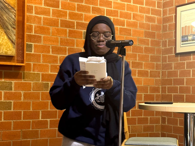 Student Shannette Wahor reads a poem