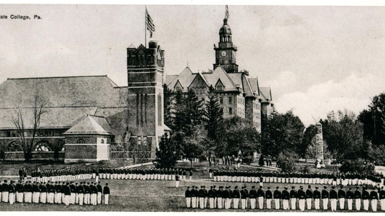 Penn State cadets stand near the Armory and Old Main in 1910