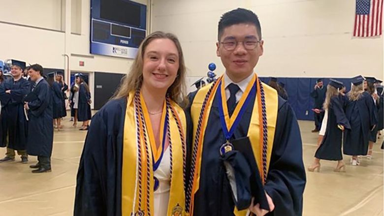 Jazzmine McCauley (left) with Ziwei (Will) Lin at the 2024 Penn State Altoona spring commencement ceremony
