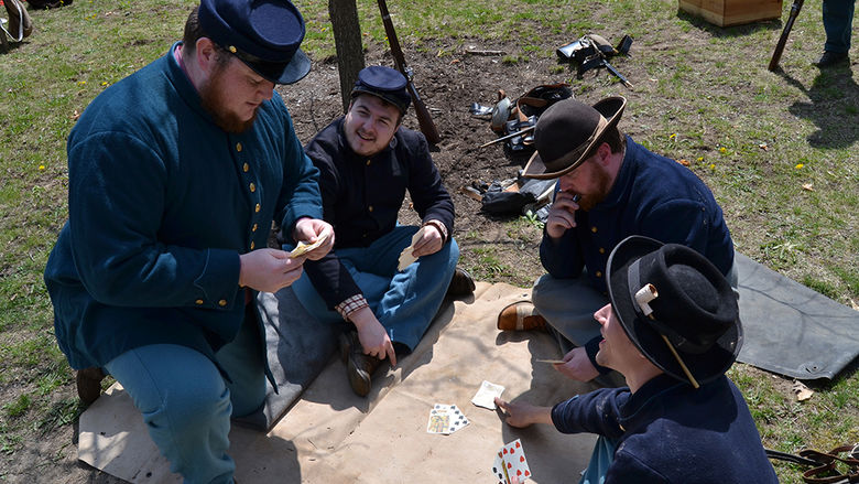 Reenactors playing cards as part of the Penn State Altoona History Encampment