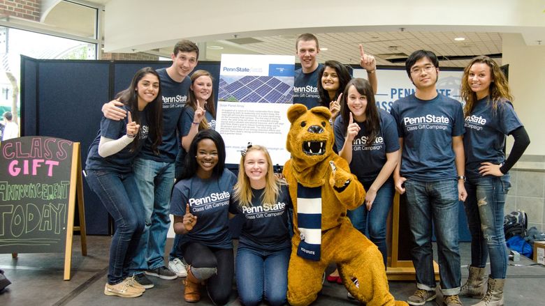 A group of students and the Nittany Lion pose with the 2015 class gift announcement.