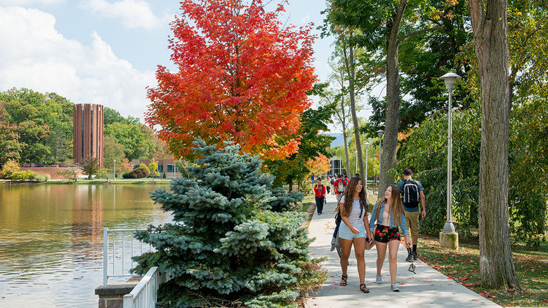 Students walking by the reflecting pond