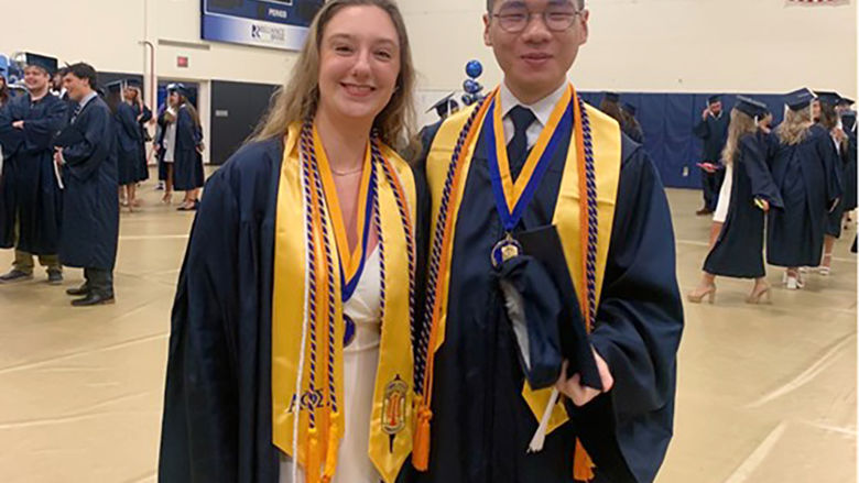 Jazzmine McCauley (left) with Ziwei (Will) Lin at the 2024 Penn State Altoona spring commencement ceremony