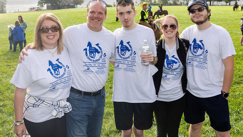 Carson and Sydney with their parents and Sydney’s fiancé, Matt, whom she met at Penn State Altoona. The group is at a therapeutic horseback riding event.