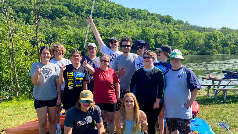 Emma Rebar (far left) and Taylor Greene (kneeling on right) organized a We Are Friends day of kayaking at Canoe Creek State Park over the summer.