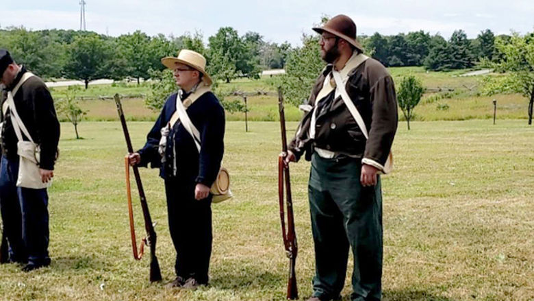 James Miller, right, participates in musketry demonstrations during Living History Day.