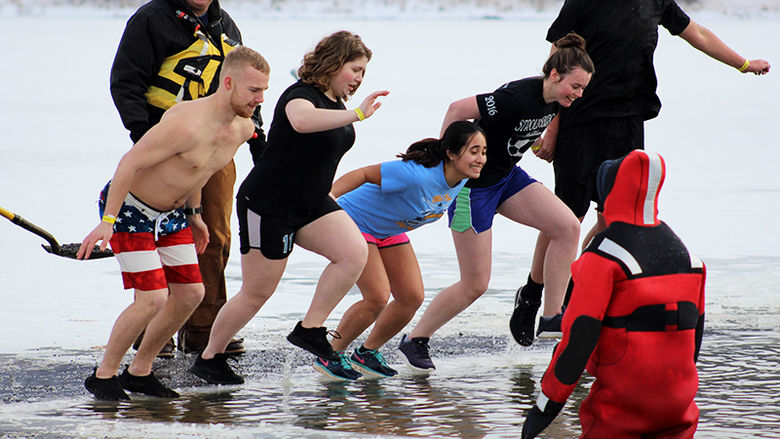 Students jump into icy water to raise funds for the annual Winter Plunge