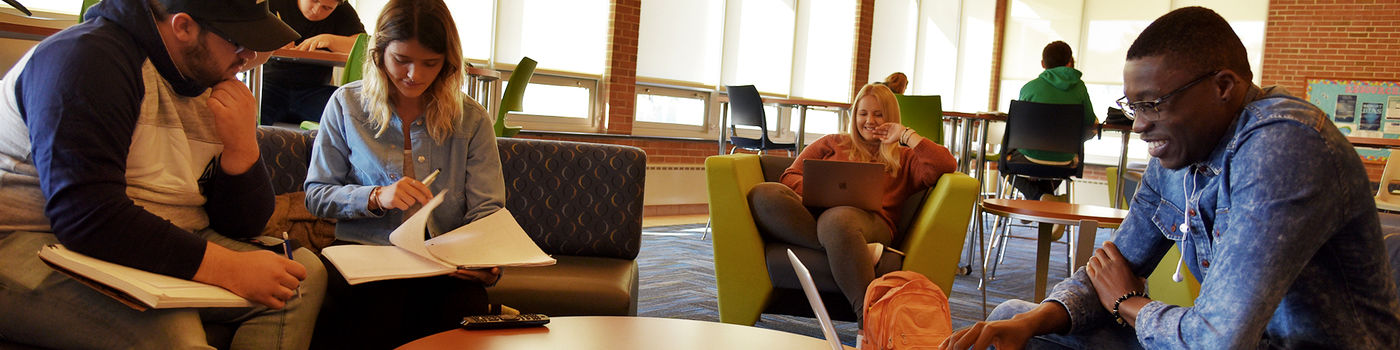Students hanging out in a residence hall lounge area