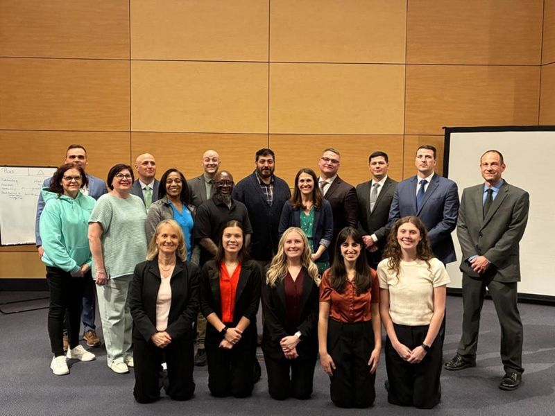 Penn State Altoona students Ally Black (first row, second from left), Devlin Glenn (first row, third from left), Abigail Hayes (first row, fourth from left), and Katelyn Kurtz (first row, fifth from left) join their mentor Dr. Nathan E. Kruis, (last row, first from left) and representatives from Penn State Health and the Pennsylvania State Police at the Keystone Model of Crisis Management workshop held at Penn State Great Valley on April 28, 2025.