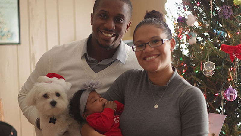 Fisher with her husband and her daughter, Mia.