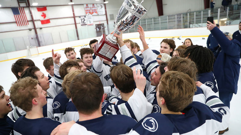 The Penn State Altoona hock team celebrates their College Hockey East championship win in February.