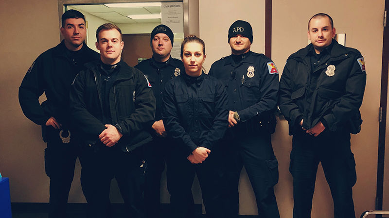 Jordyn Greene with Altoona Police Department Officers