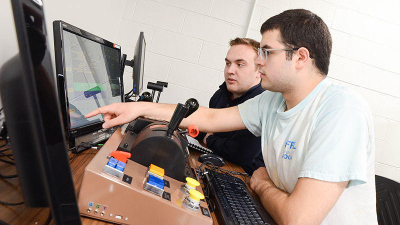 Penn State Altoona students Michael Kozik and John Yohn experiment with the Positive Train Control Prime Simulator from PS Technology.