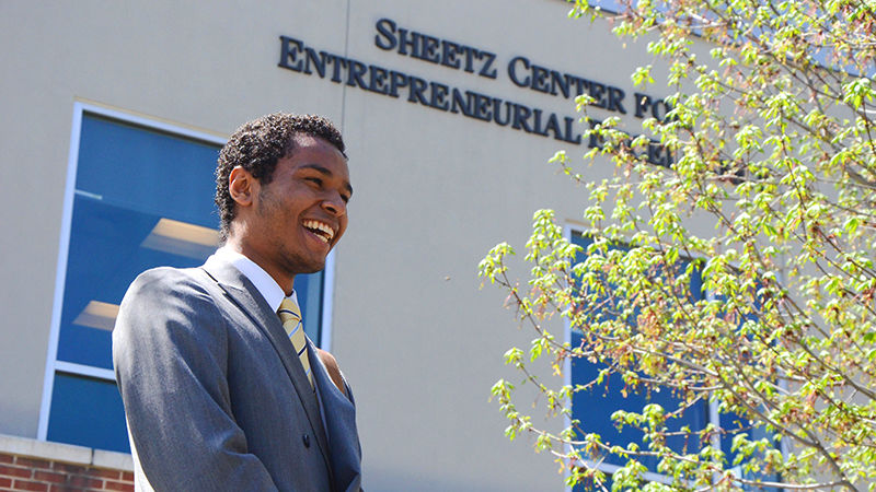 Joey Hernandez in front of the Sheetz Center for Entrepreneurial Excellence