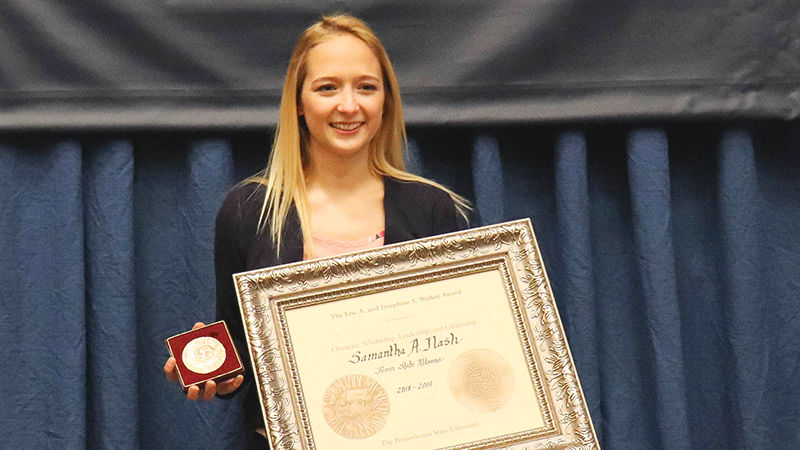 Samantha Nash poses with the Walker Award during the Student Awards Ceremony, held April 28, 2019.