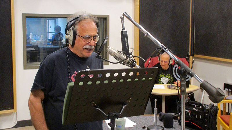 Jerry Zolten records voice overs while Frank Christopher records