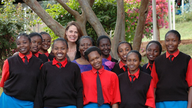 Latsko-Lockhart pictured with the first 10 girls to participate in the Global Give Back Circle.