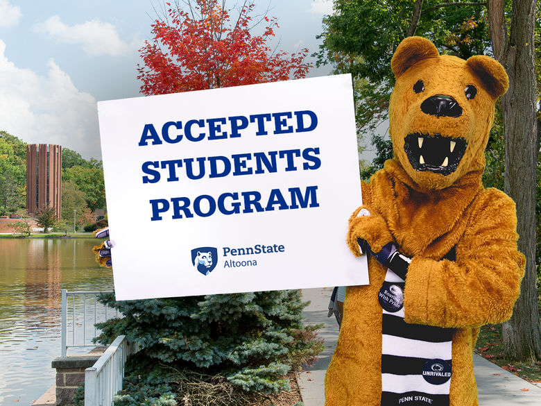 The Nittany Lion mascot holding a sign advertising the college's Accepted Students Program