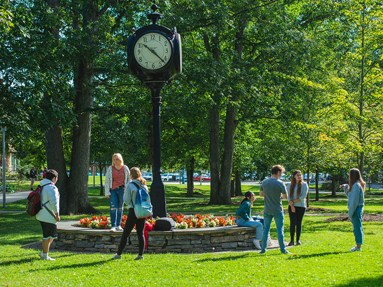 Students hanging out around the railroad clock