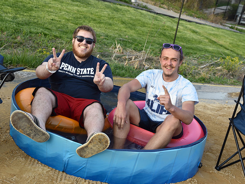 Students soaking in a mini pool at the Penn State Altoona Beach Party celebration