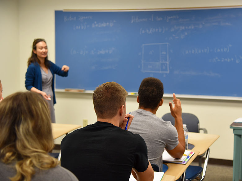 A female math faculty member teaching a class