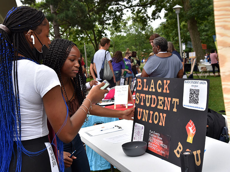 Students learn about the Black Student Union during the involvement fair