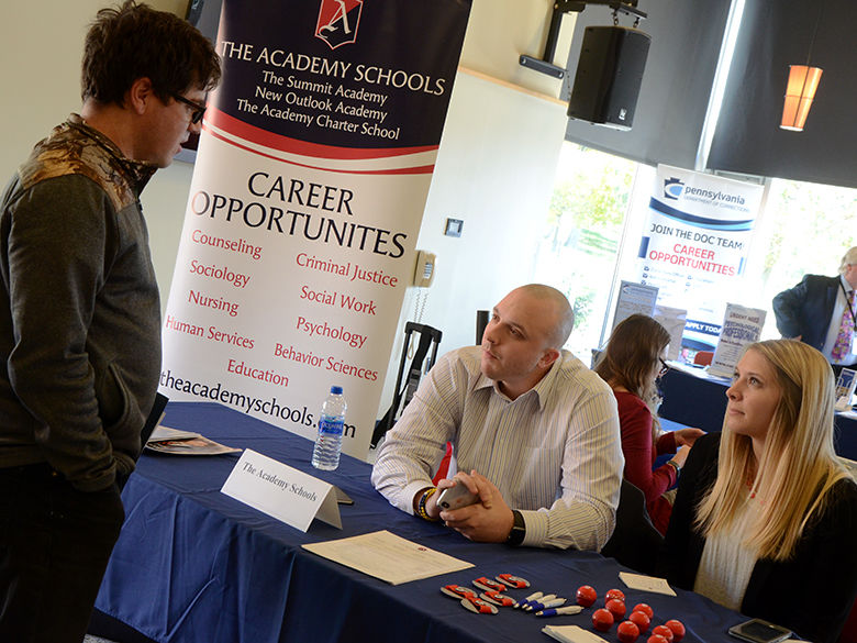 Employers and students meeting during a career fair