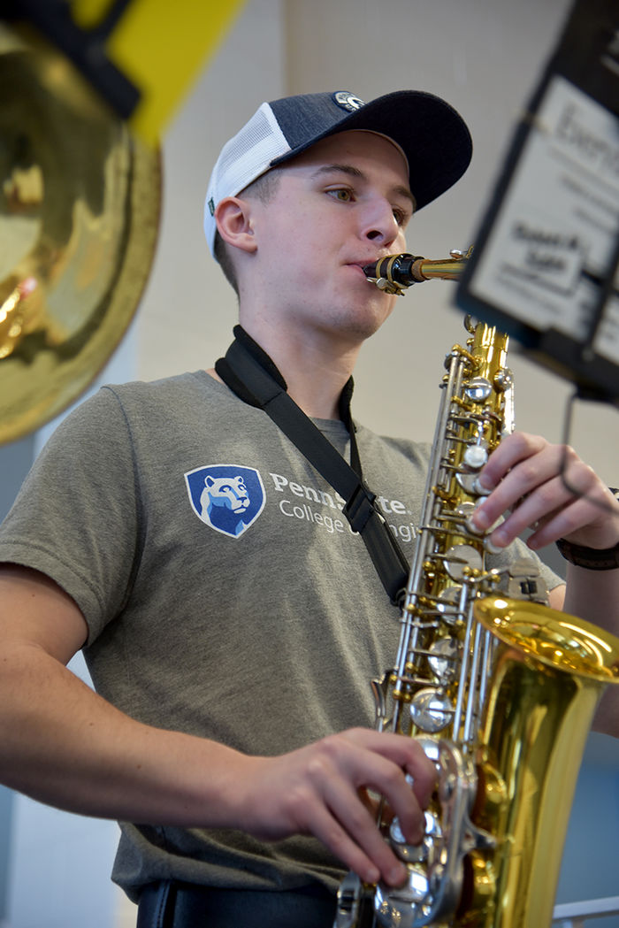 Blaine Davidson and his alto saxophone. Davidson is studying electro-mechanical engineering.