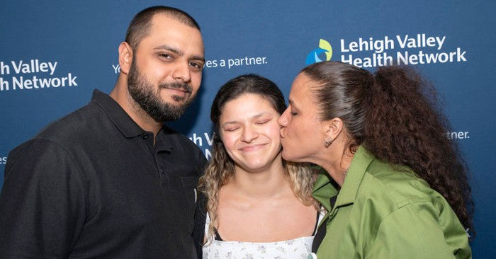 Camacho with her brother Antony and mother Aida at the Trauma Survivors Ceremony.