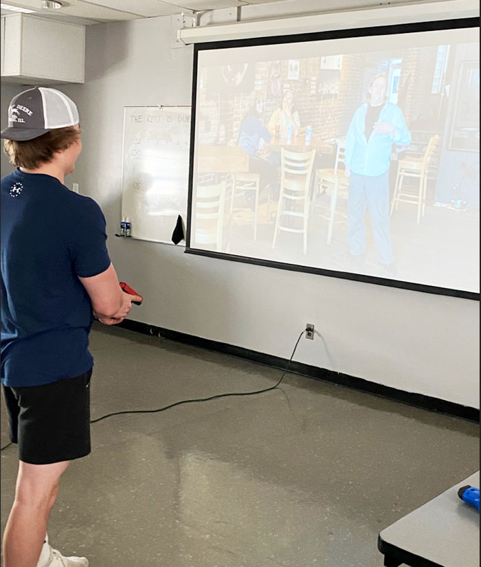 First-year criminal justice student Cole Remsnyder participates in PSP use of force simulator training.