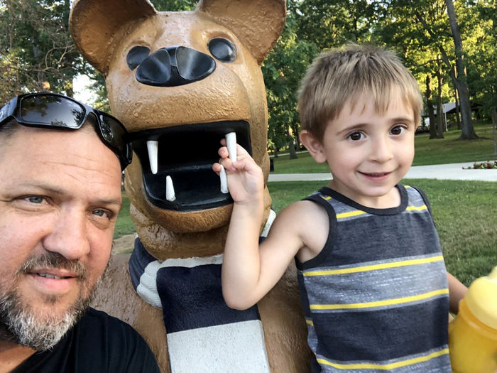 Steve Farella on campus with his youngest son, Santino.