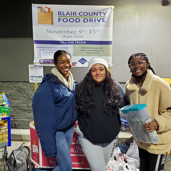 BSU members Maya Powell, Sarah Desrosiers, and Jade Bramwell volunteer for the Blair County Food Drive held in Nov. 2021.