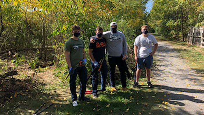 Jimmy Fogarty, Eric Cammarata, Patrick Leary, and Dayton Strength volunteer along the Bell’s Gap Rails to Trails in partnership with St. Luke’s church.