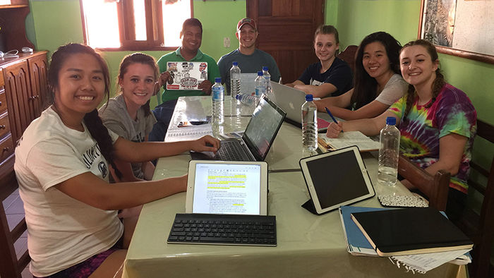 After days performing market research, the students posed with Saúl Peralta while working on their marketing plan.
