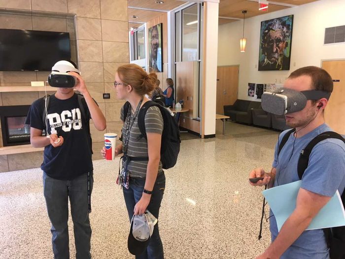 Students looking at 360 virtual reality videos