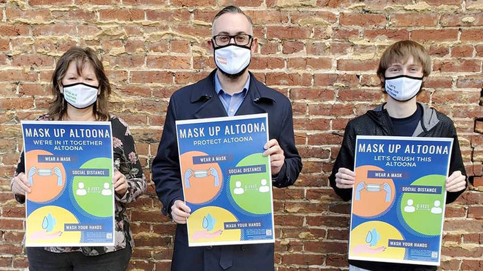 Joey Roesch stands with LaVonne Falbo, Altoona Area Business Community president, and Mayor Matt Pacifico to promote Mask Up Altoona.