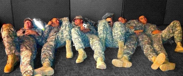 Michael Balmford (L) with fellow soldiers at Fort Campbell, Kentucky, waiting for busses.