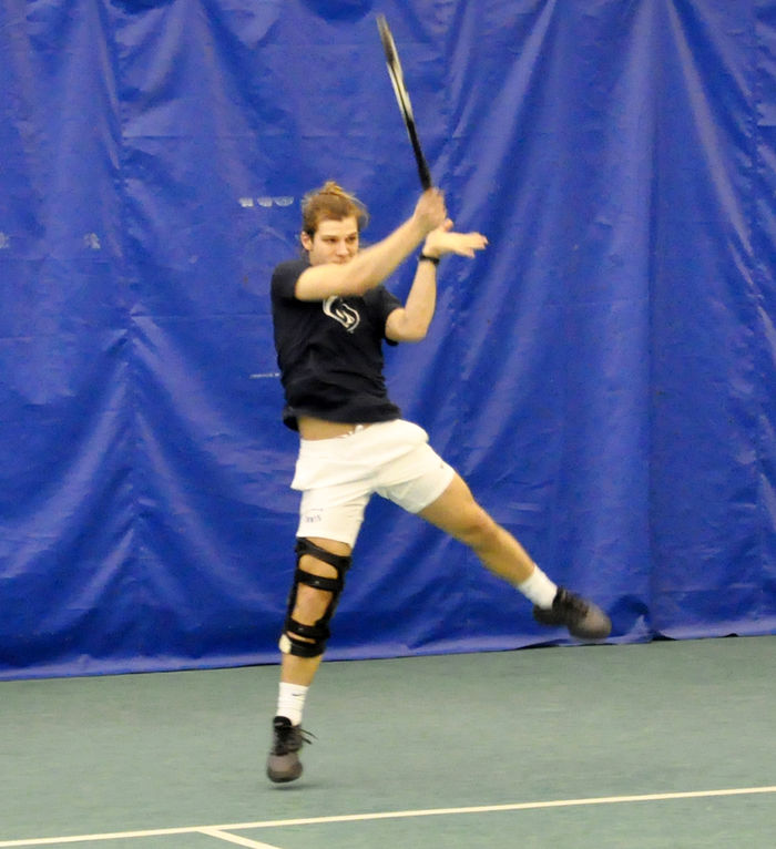 Micah Brinker playing tennis