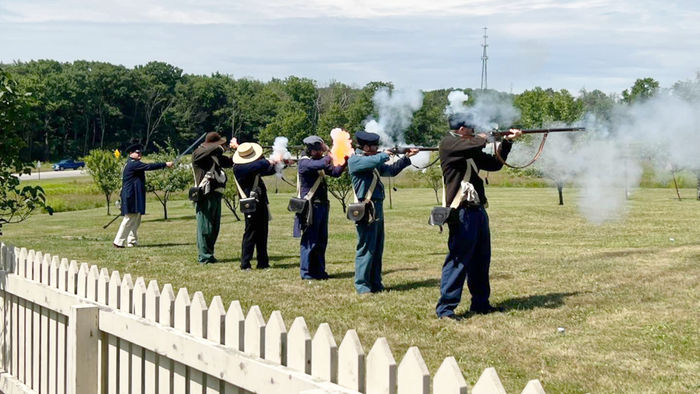 Second from left, James Miller, takes part in musketry demonstrations during Living History Day.