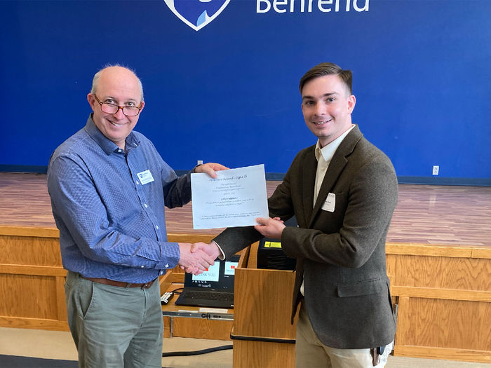 Penn State Altoona student Nicholas Glunt receiving second place honors for his psychology research poster at the spring 2022 Undergraduate Research and Creative Accomplishment Conference