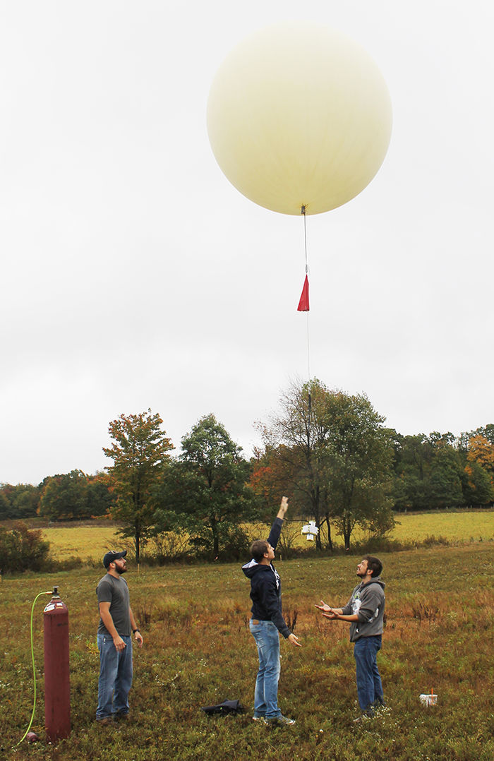 EMET students watch as their balloon launches