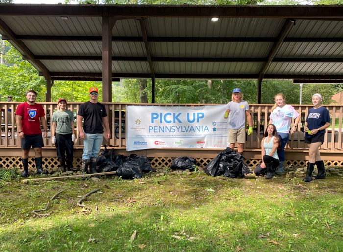 Students from Bio Club, Ag Club, and Tribeta at an annual stream cleanup event on campus.