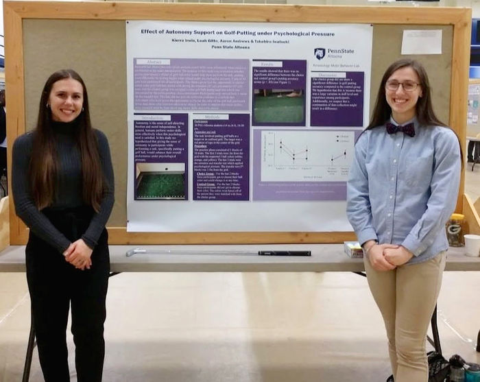 Leah Gitto and Kierra Irwin with their poster at the Undergraduate Research and Creative Activities Fair