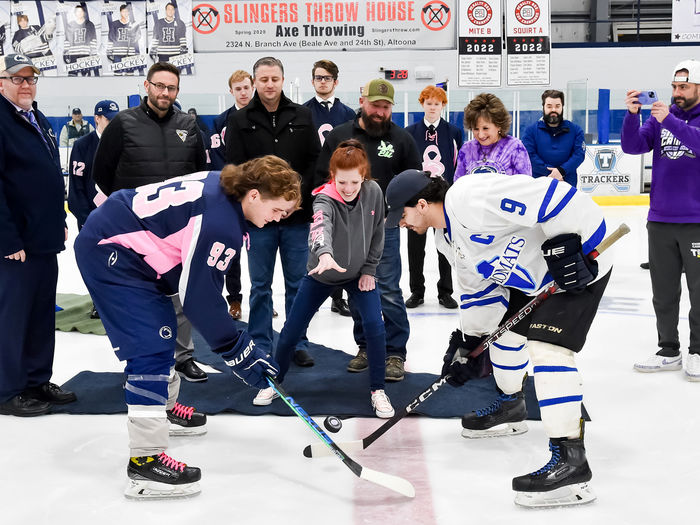 Marissa Carney, Penn State Altoona’s media and public relations coordinator and breast cancer survivor, performs the ceremonial puck drop.