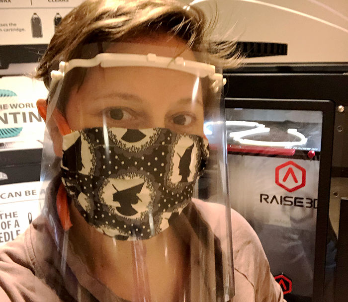 Rebecca Strzelec models a face shield with 3D printed headbands