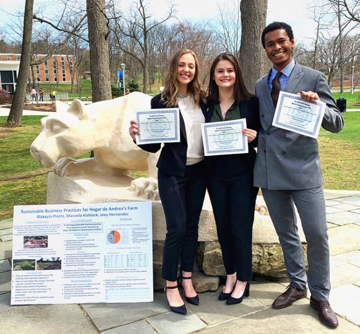 Joey Hernandez poses with partners Marcella Kishlock and Makayla Plants at the annual Undergraduate Research and Creative Activities Fair.